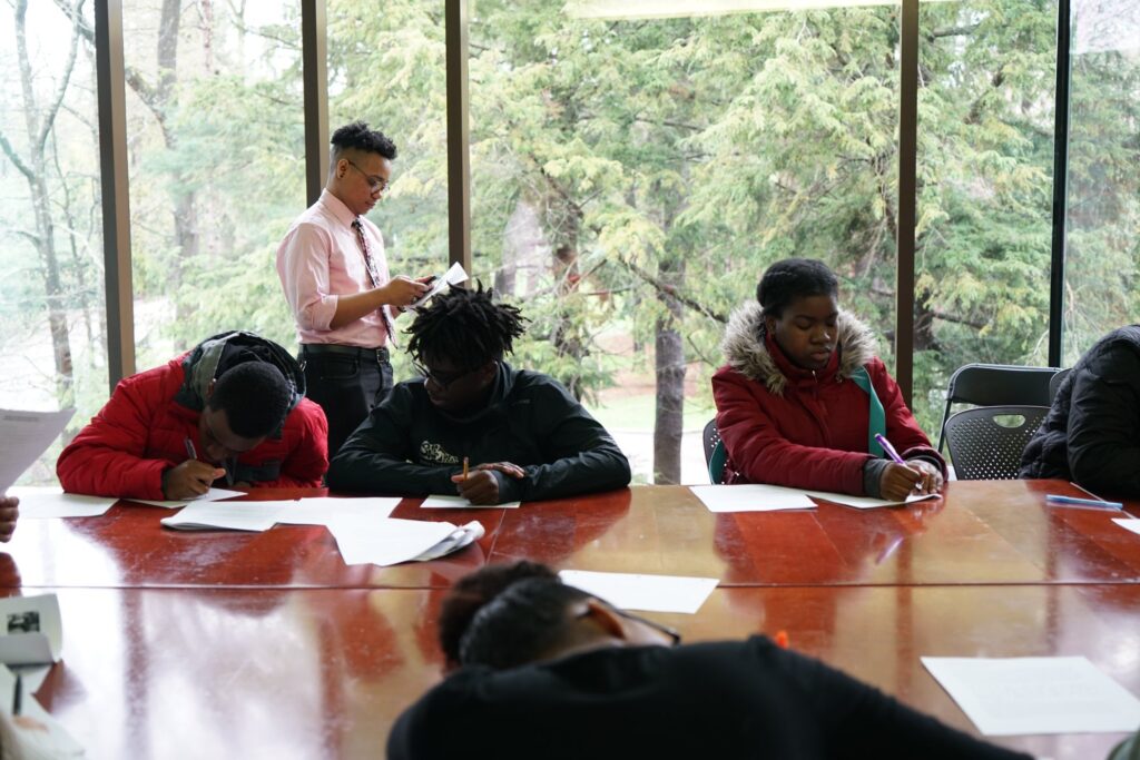 Students working with poet Eddie Maisonet at the Wellesley College Student Day of Poetry
